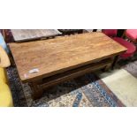 A French Brutalist oak coffee table, width 137cm, depth 57cm, height 46cm