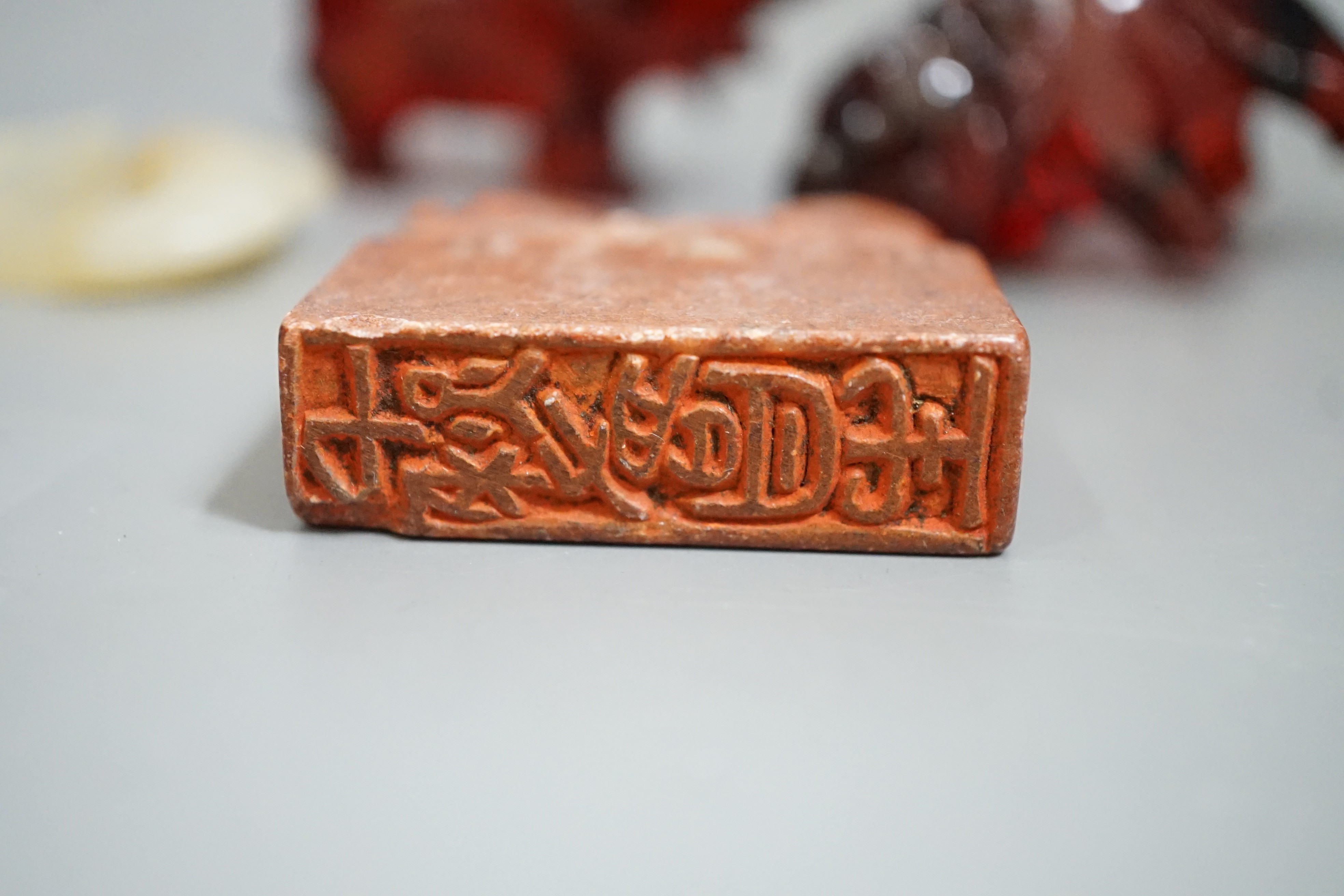 A Chinese Jade bi disc, two cherry amber ox and a soapstone seal - Image 3 of 4