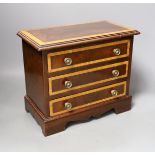 A miniature inlaid mahogany chest, 29cms wide x 25.5 cms high