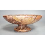 A small polished puddingstone tazza, 23cms diameter