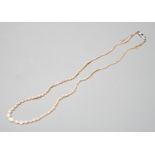 A single strand graduated natural saltwater pearl necklace, with sapphire and diamond set clasp,