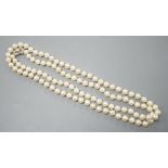 A long single strand cultured pearl necklace with cultured pearl set 9ct white gold clasp, 75cm.