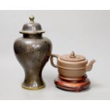 A Chinese cloisonné enamel vase and cover, 25cm tall, and a Chinese Yixing redware teapot