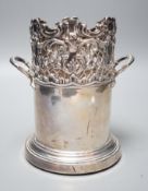 An Edwardian pierced silver mounted two handled syphon stand, by Goldsmiths & Silversmiths Co Ltd,