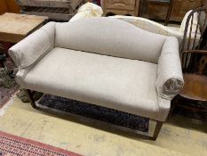 A pair of Victorian style upholstered settees with hump backs, scroll arms on square tapered legs,