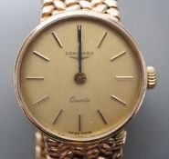 A lady's 9ct gold Longines quartz wrist watch on an inegral 9ct gold bracelet, with Longines box,