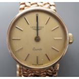 A lady's 9ct gold Longines quartz wrist watch on an inegral 9ct gold bracelet, with Longines box,