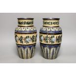 A pair of Doulton Lambeth vases, c.1885, 25.5cms high (a.f.)
