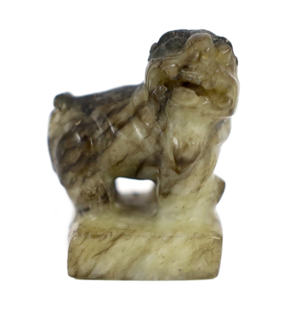 A Chinese pale celadon and black jade ‘lion-dog’ seal, 18th/19th century, the creamy white stone