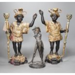 A pair of bronze blackamoor candlesticks and one other spelter figural candlestick, tallest 39cm