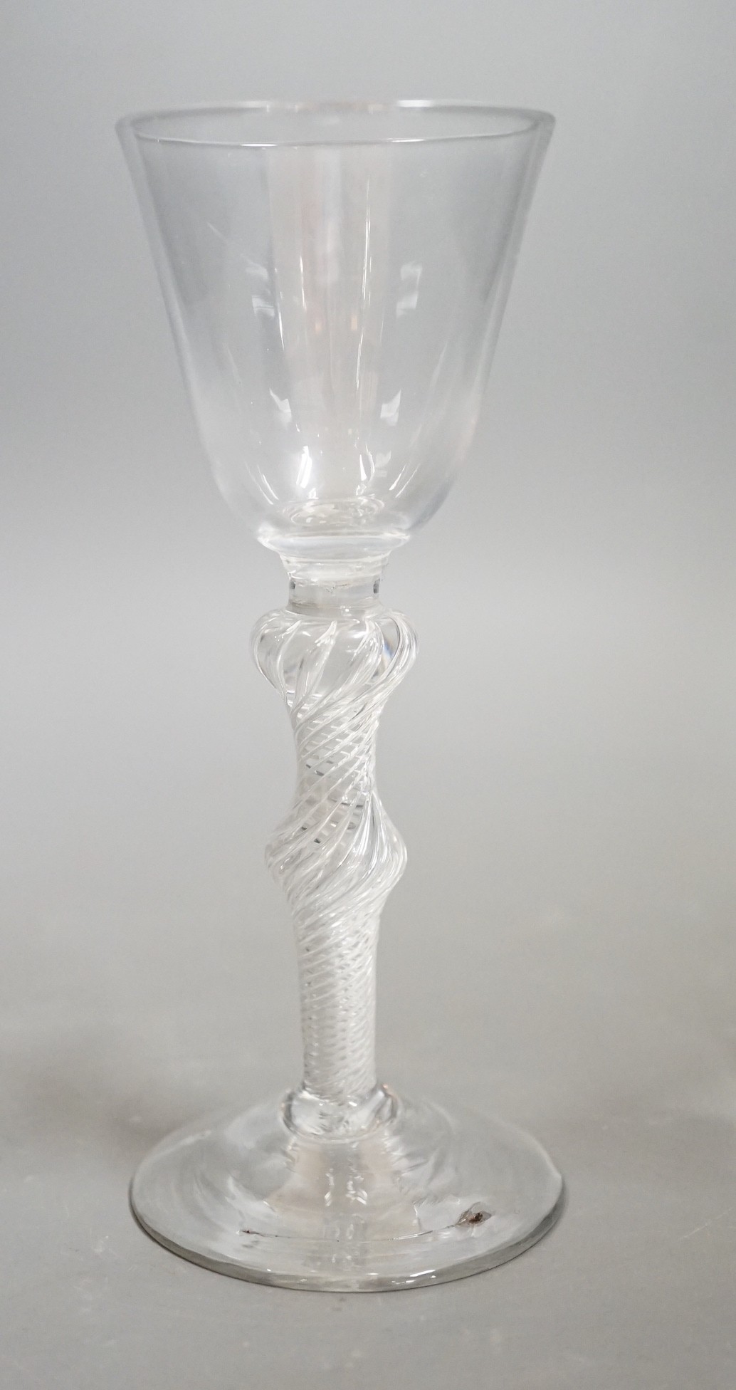 A mid 18th century double knop airtwist wine glass, 16cms high