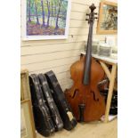 A double bass and three various violins, double bass 165cms high