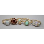 Five assorted modern 9ct gold and gem set dress rings, including white opal and diamond chip