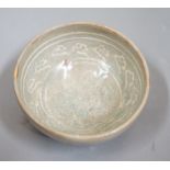 A Korean slip decorated celadon small bowl, Koryo dynasty. 10cm diameter Provenance- collected by