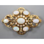 An early 1970's 9ct gold, graduated oval white opal and split pearl set brooch, of quatrefoil