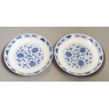 A pair of Chinese blue and 'white lotus' dishes, Qianlong marks, 16.5cms diameter