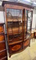 An early 20th century George III style satinwood banded mahogany inlaid bow front display cabinet,