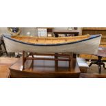 A model clinker built rowing boat with oars and stand, length 150cm