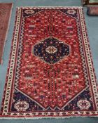 A North West Persian red ground carpet, 290 x 196cm