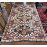 An antique Caucasian ivory ground Karabagh triple medallion rug, 224 x 130cm