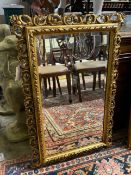 A reproduction rectangular gilt composition wall mirror, width 59cm, height 88cm