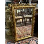 A reproduction rectangular gilt composition wall mirror, width 59cm, height 88cm