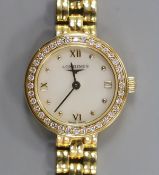 A lady's 18ct gold Longines quartz wrist watch, with mother of pearl dial and diamond chip set