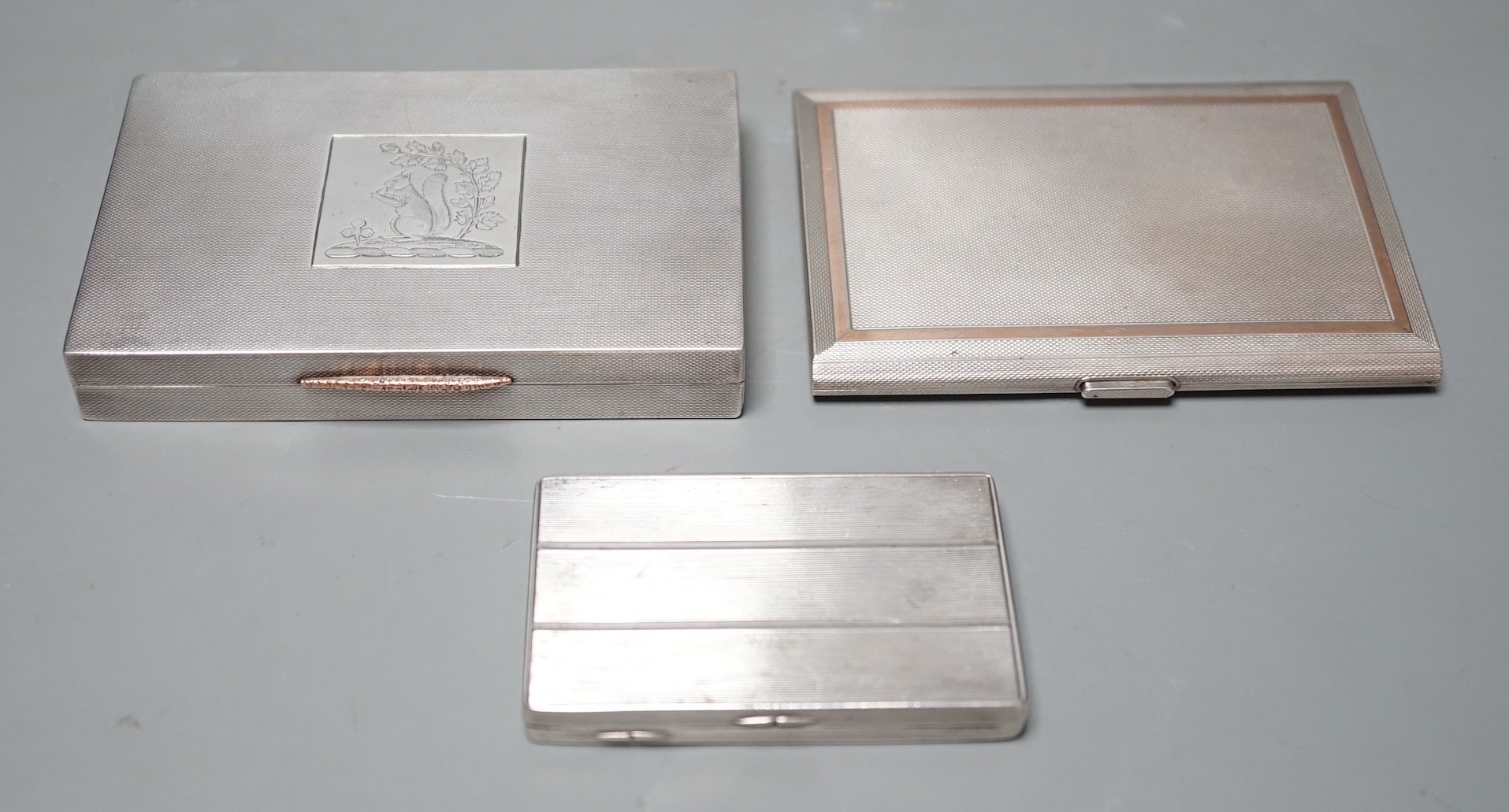A George VI engine turned silver rectangular cigarette box/case, engraved with a squirrel, W.H.