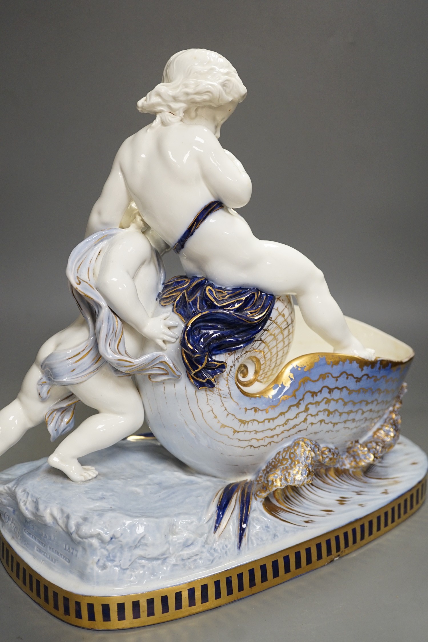 A Copeland porcelain putti seated on a shell centrepiece, modelled O. Hale, c.1877, 35cms high - Image 12 of 14