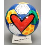 Romero Britto (Brazilian, 1963-), a ceramic football, 26cm
