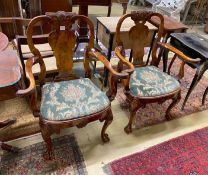 A pair of Queen Anne revival walnut elbow chairs with eagle head carved arms, width 82cm, depth