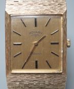 A gentleman's early 1970's textured 9ct gold Rotary manual wind dress wrist watch, with baton