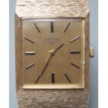 A gentleman's early 1970's textured 9ct gold Rotary manual wind dress wrist watch, with baton