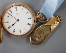 An early 20th century engraved 9ct gold hunter fob watch, with Roman dial, gross 36.7 grams, on a