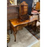 A Queen Anne Revival serpentine walnut kneehole dressing table, width 121cm, depth 54cm, height 76cm