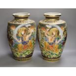 A pair of Japanese moulded and moriage decorated vases, 31cms