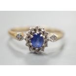 A modern 9ct gold, sapphire and diamond set cluster ring, size R, gross 2.3 grams.