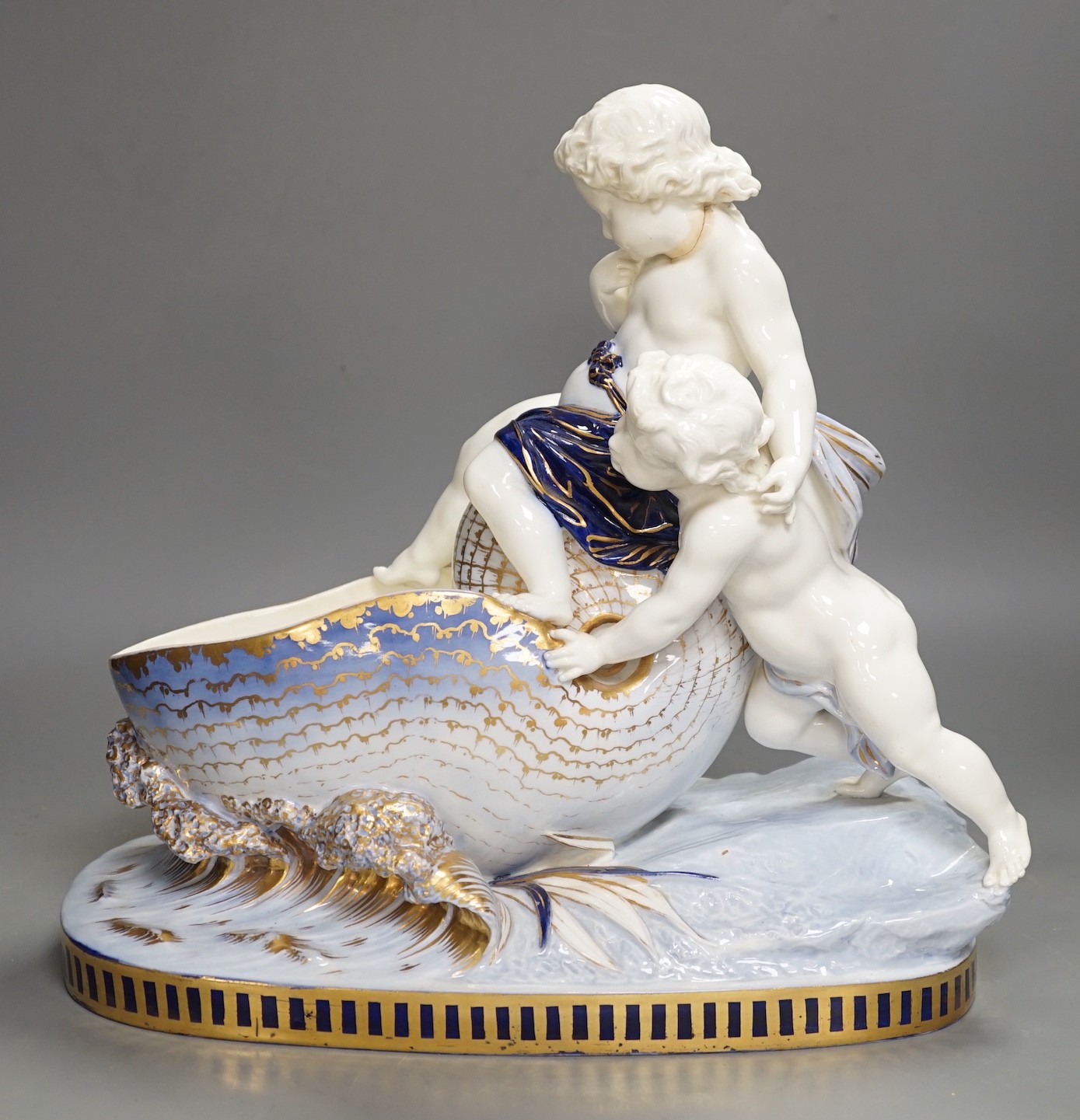 A Copeland porcelain putti seated on a shell centrepiece, modelled O. Hale, c.1877, 35cms high - Image 8 of 14