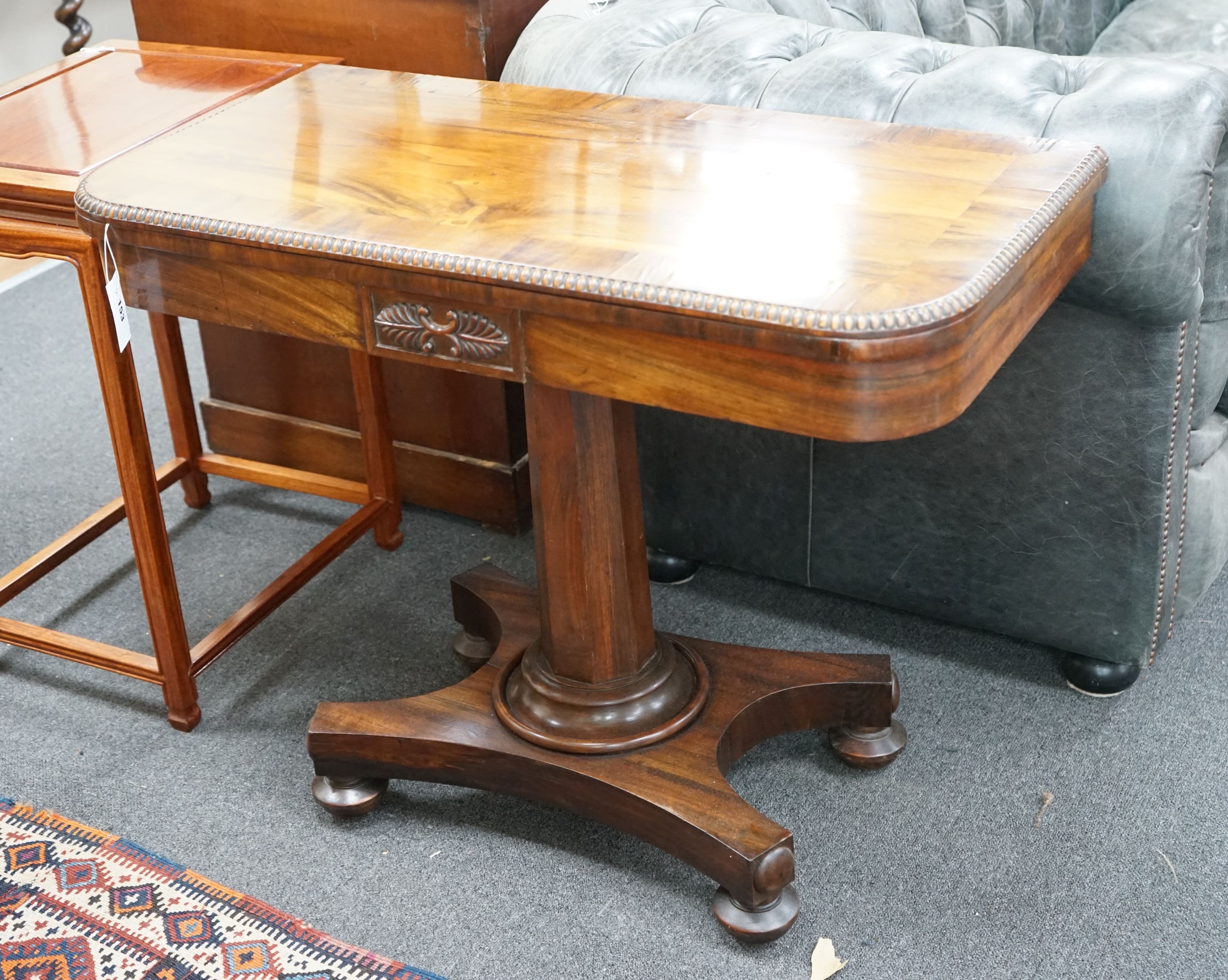 A Regency Gonçalo Alves rectangular folding card table, width 90cm, depth 45cm, height 73cm