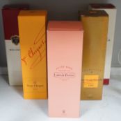 A boxed bottle of Veuve Clicquot 1999 vintage Champagne, a similar boxed NV Champagne, two boxed