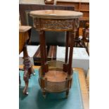 A circular French gilt metal mounted two tier table, diameter 36cm, height 74cm