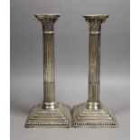 A pair of Edwardian silver Corinthian column candlesticks, Hawksworth, Eyre & Co, Sheffield, 1903,