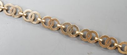 A modern 9ct gold interwoven circular link bracelet, 17.5cm, 8.3 grams.