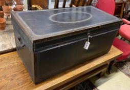 An early 19th century brass mounted studded black leather trunk, length 92cm, depth 46cm, height