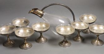 A set of eight sterling dessert coupes with glass inserts, height 6mm, together with a modern