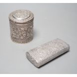 An Indian embossed white metal cigar case, 12.2cm and a similar canister and cover.