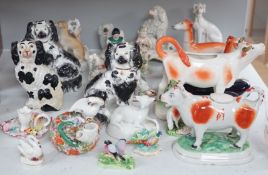 A quantity of Victorian Staffordshire animal figures, two pearlware putti and a Derby figure of a