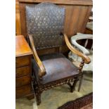 A French 19th century walnut and leather fauteuil, width 59cm, depth 60cm, height 115cm