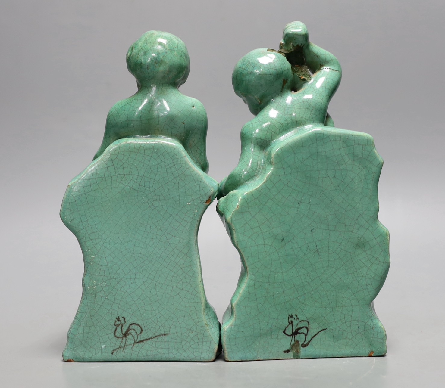 A pair of Cantagalli green monochrome putti figural bookends, 19cms high - Image 2 of 3