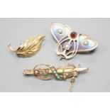 A continental Art Nouveau 900 gilt white metal, cabochon stone, seed pearl and enamel set brooch,